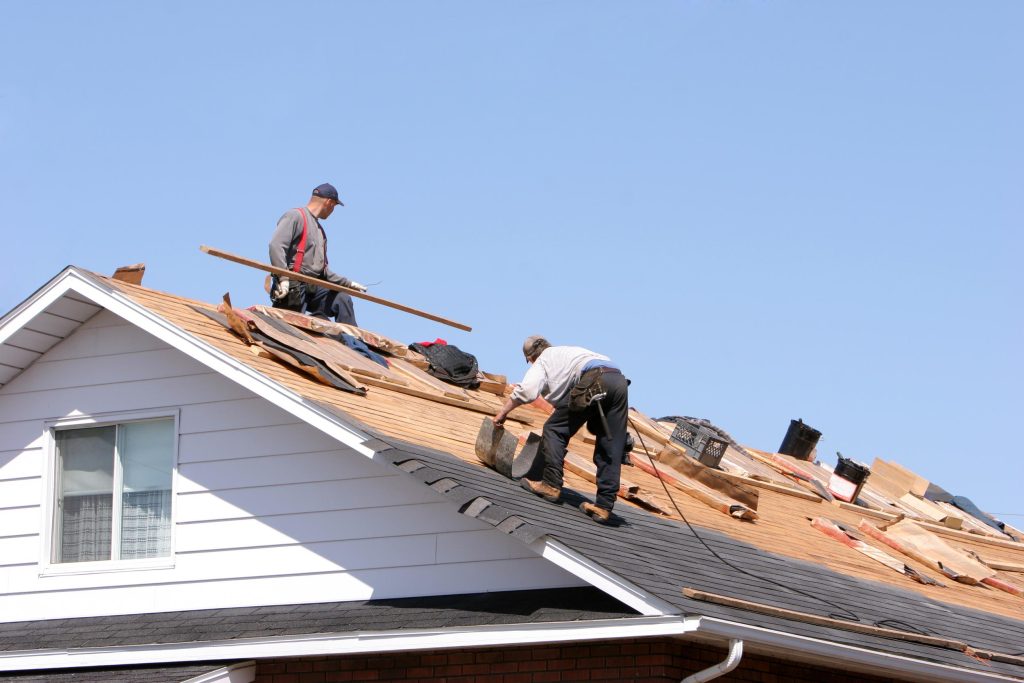 Two workers on residential roof